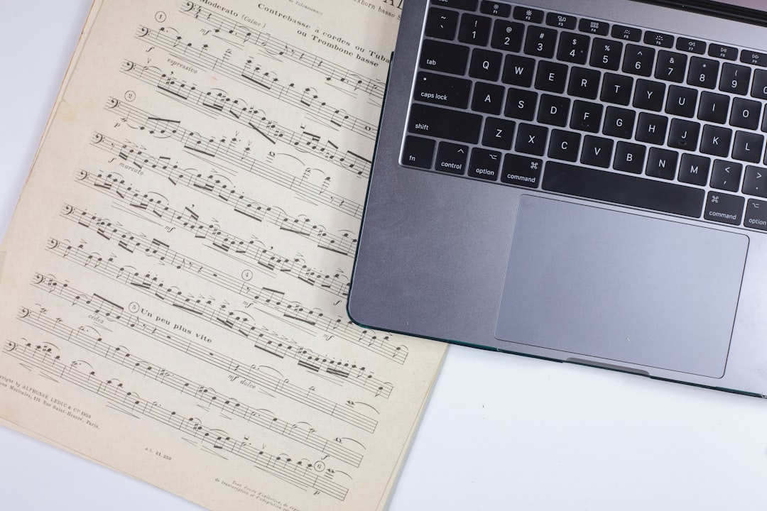 Conclusion by Uniphonic white printer paper beside gray laptop computer