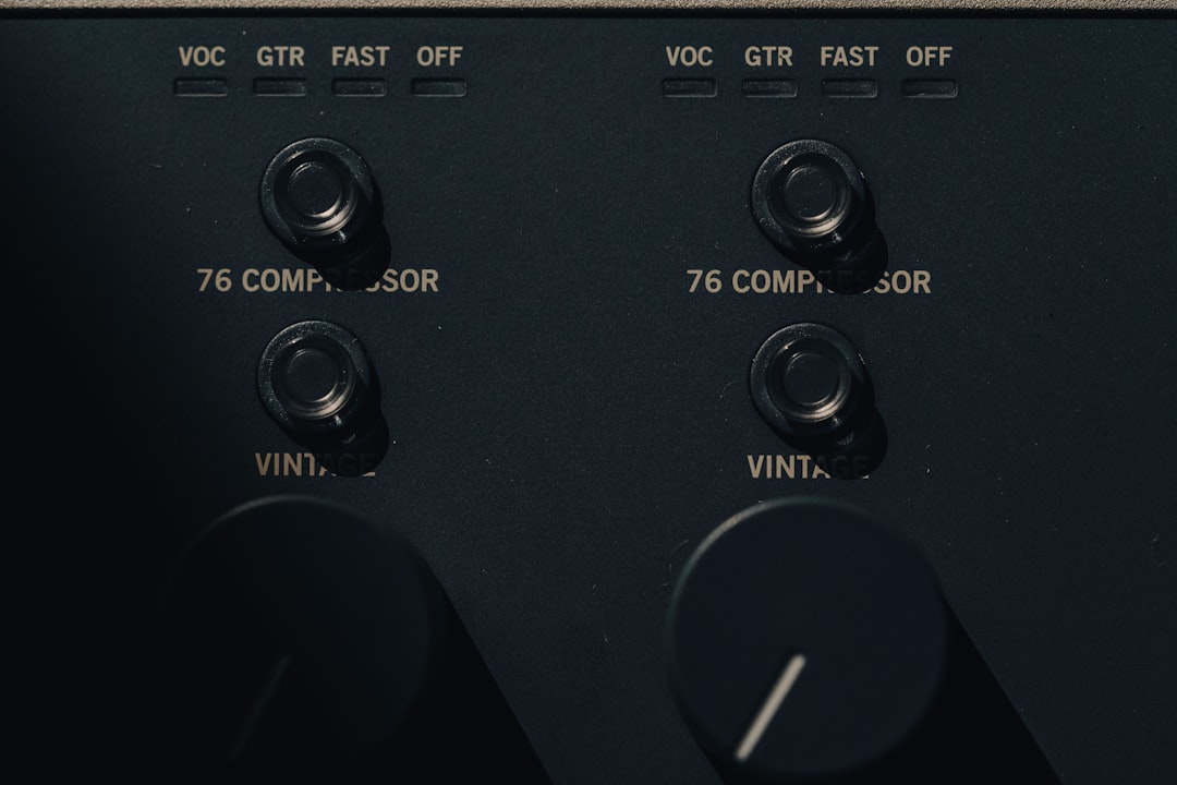 a close up view of the knobs on a black electronic device