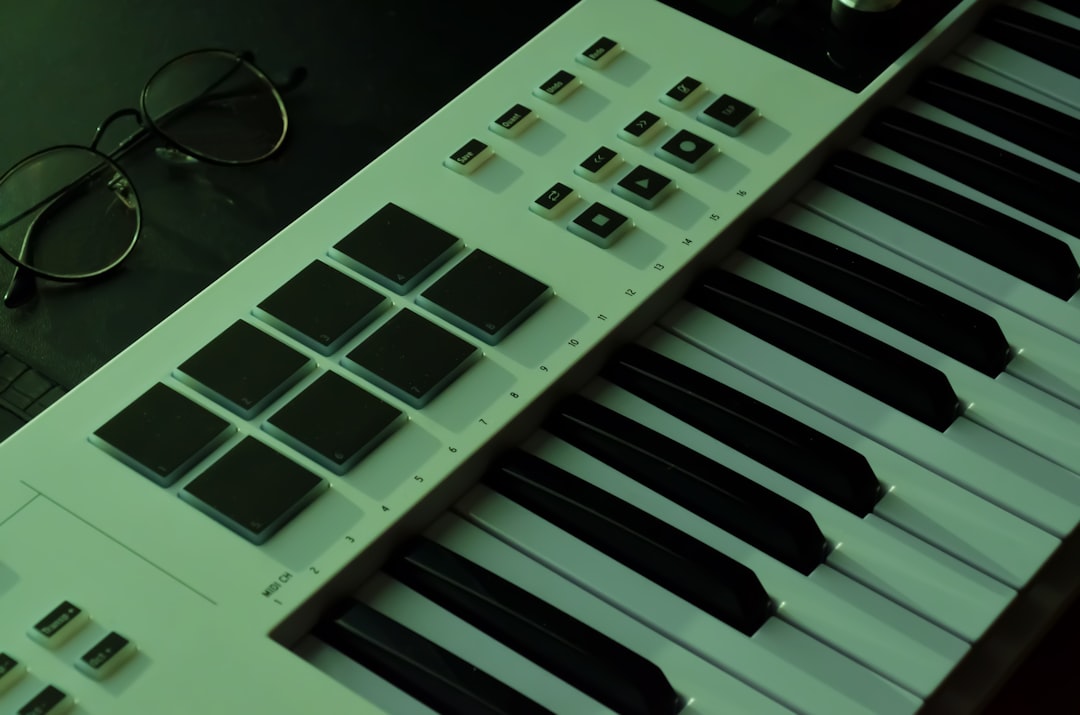 ❓ FAQ: Your Burning Questions Answered by Uniphonic a close up of a keyboard with glasses on it